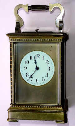 C.1900, French, Brass Cased Carriage Clock in a stylized Anglaise case with turned quarter columns at each corner, and rippled molding top and bottom, time, strike and repeat, 8-day. — Antique Clocks Price Guide