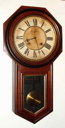 C.1901, Ansonia Clock Co., "Office Regulator", 8-day time and strike, long drop octagon, sometimes called "school clock". — Antique Clocks Price Guide