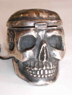 C.1840, French, Verge- Fusee Watch Movement in an unmarked silver skull case with hinged cranium, revealing the dial beneath. Both dial and movement marked "Vasse, Paris". — Antique Clocks Price Guide