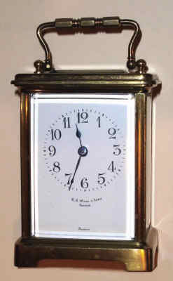 C.1910, French, Brass Cased Carriage timepiece, in a late "Obis" case of stamped brass, made for N. G. Wood and Sons, Boston, both dial and movement signed. — Antique Clocks Price Guide