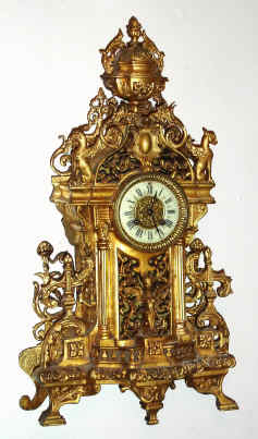 C.1890, French, Gilt Bronze architectural mantel clock with figures, 8-day time and strike with porcelain dial. — Antique Clocks Price Guide