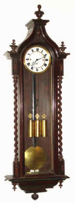 C.1860, Austrian, 3-Wt, Grand Sonnerie, VIENNA REGULATOR, in a walnut case with Gothic twisty columns up the sides, 8-day, 72 beat.. — Antique Clocks Price Guide