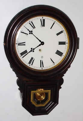 C.1910, E. Ingraham and Co., DEW DROP timepiece, 8-day spring, in a grained poplar case. — Antique Clocks Price Guide