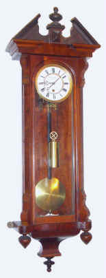 C.1875, Austrian, Jos Lipperl, Leoben, small 1-wt timepiece with a 5" dial, and in a walnut transitional case. — Antique Clocks Price Guide