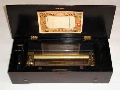 C.1875, Swiss, 12-tune Music Box, with 11" cylinder and original tune sheet. — Antique Clocks Price Guide