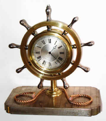 C.1890, French, Decorative Desk timepiece, with a jeweled lever movement, 8-day, with engine turned dial center, moon hands and ship's wheel surround. The base is decorated as an actual "deck" with individual planks clearly defined. — Antique Clocks Price Guide