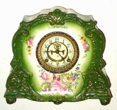 C.1900, Ansonia Royal Bonn, La Marne, porcelain china clock, forest green with multi color floral accents, and with open escapement dial. — Antique Clocks Price Guide