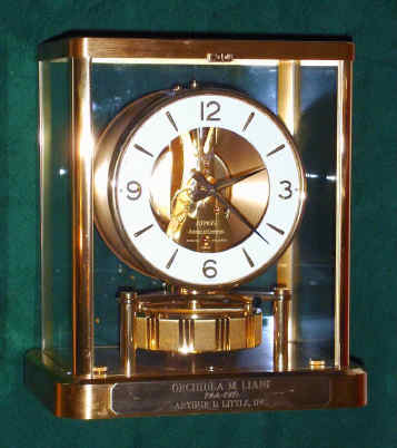 C.1990, Swiss, LeCoultre, ATMOS, or self winding, perpetual running clock, wound by changes in temperature and pressure, serial 626644. A presentation to Orchidea Liani for 25 years of service to Arthur Little, Inc. — Antique Clocks Price Guide