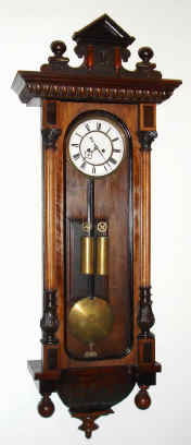 C.1890, German, 8-day time/strike 2-weight walnut case "Vienna regulator" in the alt-Deutsch style. Movement is marked "Remember". — Antique Clocks Price Guide