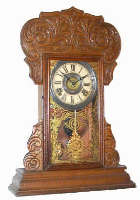 C.1902, Waterbury Clock Co., AMHERST, pressed oak gingerbread, 8-day time and gong strike. — Antique Clocks Price Guide