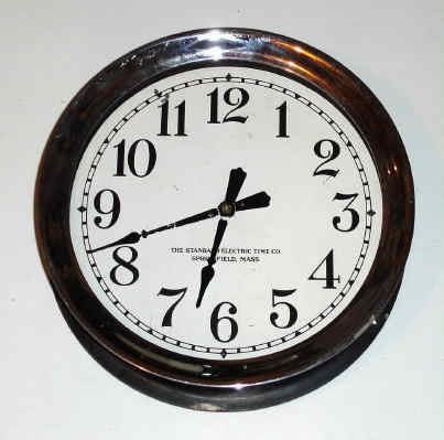 C.1910, Standard Electric Time Co., Springfield, Mass, Slave Clock cast iron tub with polished and nickeled screw bezel. — Antique Clocks Price Guide