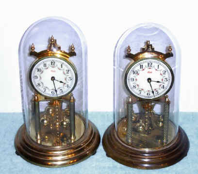 C.1970-75, Two Kundo 400-day or Anniversary timepieces with porcelain dials — Antique Clocks Price Guide