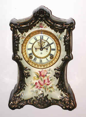 Mixed lot, C.1900, New York (Kroeber?) porcelain case, now with Ansonia 8-day time/strike open escapement movement (slightly small for case). — Antique Clocks Price Guide