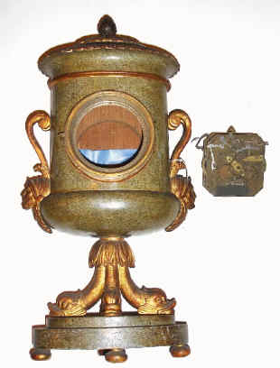 C.1810, Austrian, Carved and Patinated Wood clock case in the form of an Urn, now with a Grand Sonnerie movement from the same period, the proper size, but will require a dial and dial feet. — Antique Clocks Price Guide