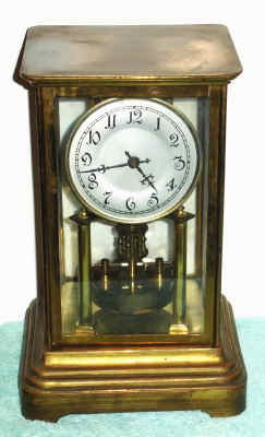 C.1908, German, Jahresuhrenfabrik, 400 Day timepiece in a sheet brass and glass case with plain glass, dial marked Germany at bottom. — Antique Clocks Price Guide