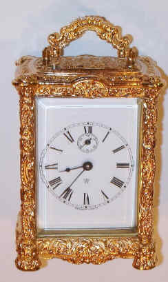 C.1905, Waterbury Clock Co., cast white metal carriage clock, gold plated, with porcelain dial. — Antique Clocks Price Guide