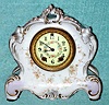 C.1898, Wm. L. Gilbert, Winsted, Conn, Porcelain No. 531, 8-day time and gong strike mantel clock, with porcelain dial and floral decorations.
