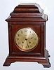 C.1917, Chelsea Clock Co / cased by Tiffany, mahogany mantel clock with 8-day time and house strike movement, serial No. 112830, and with a different Tiffany number on case. Silvered dial is 5"