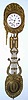 C.1860, French Morbier, 8-day time and bell strike w/ calendar, Comptoise wall clock with brass repousse dial surround with flower/basket theme, and with matching lyre pendulum, and with a sturdy purpose made wall mount.