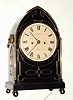 C.1830, English, Bell Strike Bracket clock. 2-fusee, in a Regency lancet top ebonized case with brass inlay, and with round painted dial bearing the name Jas. Evill, Bath.