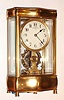 C.1910, English, Eureka Clock Co., Ltd, London, SERPENTINE 4-GLASS case, serial No. 7035, battery powered clock with large balance wheel supported in ball bearings.