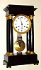 C.1840, French, Horiot, a' Paris, 4-Column, Empire style mantel clock, large, 8-day, bell strike with grid iron pendulum, mahogany case, substantial pinwheel movement signed Caillyaine on front plate.