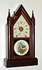 C.1879, Seth Thomas Clock Co., "Sharp Gothic", 8-day time/strike/ special alarm steeple clock. This clock is fitted with an early version of Winward's new eight-day railway "alarum". The strange lever on the upper left side of the case was used to silence the alarm. The strike train is used to activate the alarm, rather than the use of a separate movement.
