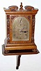 C.1900, English, J. W. Benson, London, 3-fusee, Westminster chime on large flat wire gongs, with the hours struck on a large cathedral gong, with a silvered brass dial with foliate engraving in the arch and spandrel areas, and with F/S adjust in the arch, plus original wall bracket.