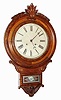 C.1900 William L. Gilbert Clock Co., CT, CIRCLE DROP, 8 day, time and strike wall clock in walnut with burled applique on both inner and outer bezels.