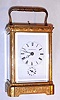 C.1890, French, Brass Cased Carriage clock, time, strike, repeat and alarm, in a profusely engraved and gilded case with inset corners, the dial signed for Happacher in Wien, the retailer.