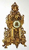 C.1890, French, Gilt Bronze architectural mantel clock with figures, 8-day time and strike with porcelain dial.