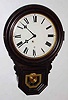 C.1910, E. Ingraham and Co., DEW DROP timepiece, 8-day spring, in a grained poplar case.