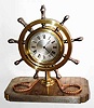 C.1890, French, Decorative Desk timepiece, with a jeweled lever movement, 8-day, with engine turned dial center, moon hands and ship's wheel surround. The base is decorated as an actual "deck" with individual planks clearly defined.