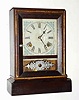 C.1883, Waterbury Clock Co., COTTAGE EXTRA, Gilt, 8-day time and strike, rosewood veneer case.