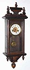 C.1920, German, Small 30 Hour wall clock, pine case with walnut finish and embossed trim.