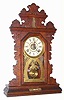 C.1895, E. Ingraham and Co., Premium Oak Gingerbread, 8-day time, strike and alarm with thermometer at top and level in base.