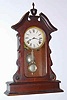 C.1880, Waterbury Clock Co., 8-day time/strike walnut mantel clock, with advertising pendulum.