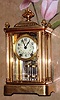 C.1907, Seth Thomas Clock Co., EMPIRE No. 44, 4-Glass or crystal regulator, in a fancy column case, gold plated and with floral finials and top urn.