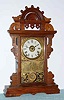 C.1890, Seth Thomas Clock Co., "Eclipse", 8-day time, strike and alarm ball top parlor clock.