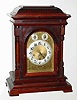 C.1915, German, Junghans, Westminster chime bracket clock, mahogany case, bell molded top, with chime-silent and F/S dials in the arch.