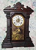 C.1889, E. Ingraham and Co., 8-day time/strike/alarm walnut mantel clock, with restorations.