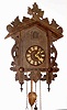 C.1920, German, 2-wt, Black Forest Cuckoo, in a carved leafy case with top rail of leaves.