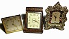Lot of Three Travel Clocks- (3); Angelus contract for "Tiffany and Co." 8-day 15J in gilt case including original outer leather travel case 2.75"H, a Jaeger 8-day alarm in snakeskin folding travel case 4.25"H, and a Cyma contract for Gorham in silver frame with collapsible stand 4.75"H.