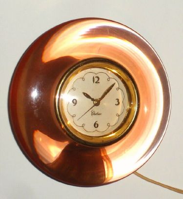 Chelsea Clock Co. "ELECRONOMETER", Model "VE", 110v electric, corded timepiece, in peach lucite case. C. 1950. — Antique Clocks Price Guide