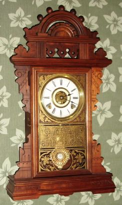 Seth Thomas Clock Co., Thomaston, Conn, "ECLIPSE" model, walnut gingerbread clock, time and gong strike, with bell alarm, 8-day, spring, fancy Eclipse pendulum. C.1890. — Antique Clocks Price Guide