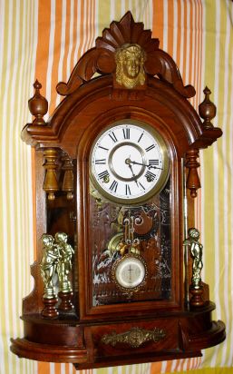 F. Kroeber, New York, "OCCIDENTAL" model, 8-day brass time and strike movement in walnut mirror-sided case flanked by two gilded cupids shelf clock, spring driven. C, 1881. — Antique Clocks Price Guide