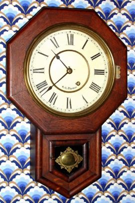 Seth Thomas Clock Co., "DROP OCTAGON 10 INCH", oak cased, short drop school clock, time only. C.1906. — Antique Clocks Price Guide