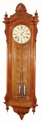 Seth Thomas Clock Co., "REGULATOR No. 19", in oak, with 12" painted dial, center seconds, 2-jar compensating pendulum, weight driven, 8-day. C.1890. — Antique Clocks Price Guide
