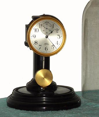 Poole Mfg Co., NY, "EXECUTIVE" model battery desk clock with molded plastic base and glass dome. C.1925. — Antique Clocks Price Guide