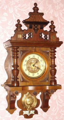 German, Junghans, Berlin style "free swinger", 8-day time and gong strike wall clock. C.1900. — Antique Clocks Price Guide
